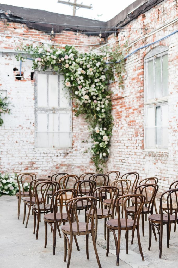 Ceremony at Industrial Warehouse with wooden chairs