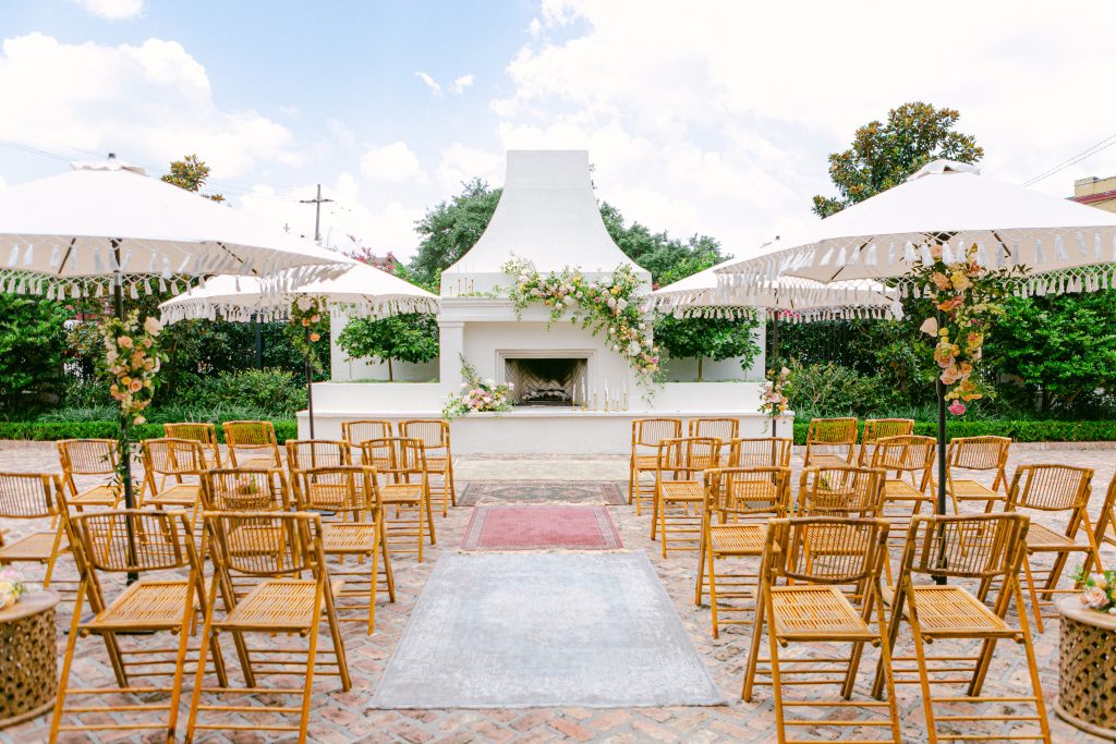 outdoor courtyard ceremony in front of fireplace